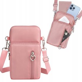   Mini roza torbica za ramo za telefon in denar - eleganten dodatek s funkcionalnostjo. Izdelana iz vodoodpornega poliestra z dodatki iz neslechetnega kovine. Ta kompaktna torba je odlična kombinacija p