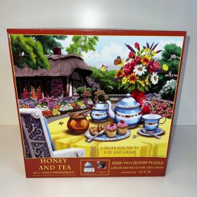    Sestavljanka 1000 MED IN ČAJ, ko je sestavljena, veliki kosi SONCE VEN