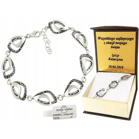   Elegantna srebrna zapestnica z ažurnim dizajnom in graviranjem